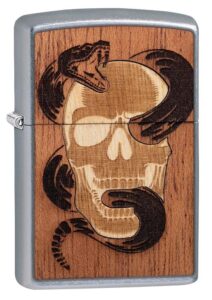 Front view of WOODCHUCK USA Skull & Snake Windproof Lighter standing at a 3/4 angle