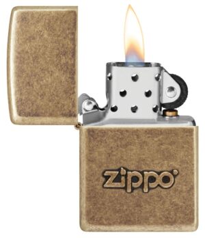 Zippo Stamp Antique Brass Lighter with its lid open and lit.