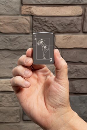 Lifestyle image of Windy Design Card Black Ice® Windproof Lighter in hand.