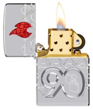 90th Anniversary Collectible of the Year 2022 Gold plate Lighter with its lid open and lit