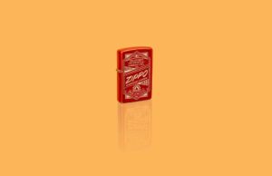 Glamour shot of Zippo It Works Design Metallic Red Windproof Lighter standing in a yellow scene.